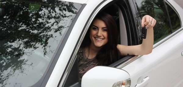 happy bad credit girl in car