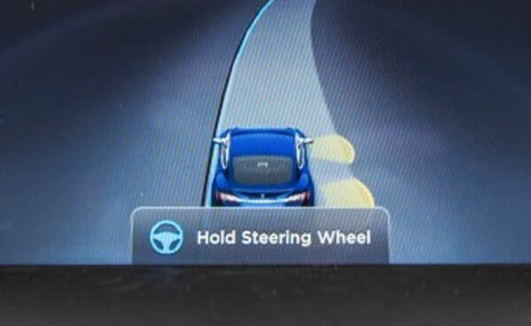 tesla autopilot warning display